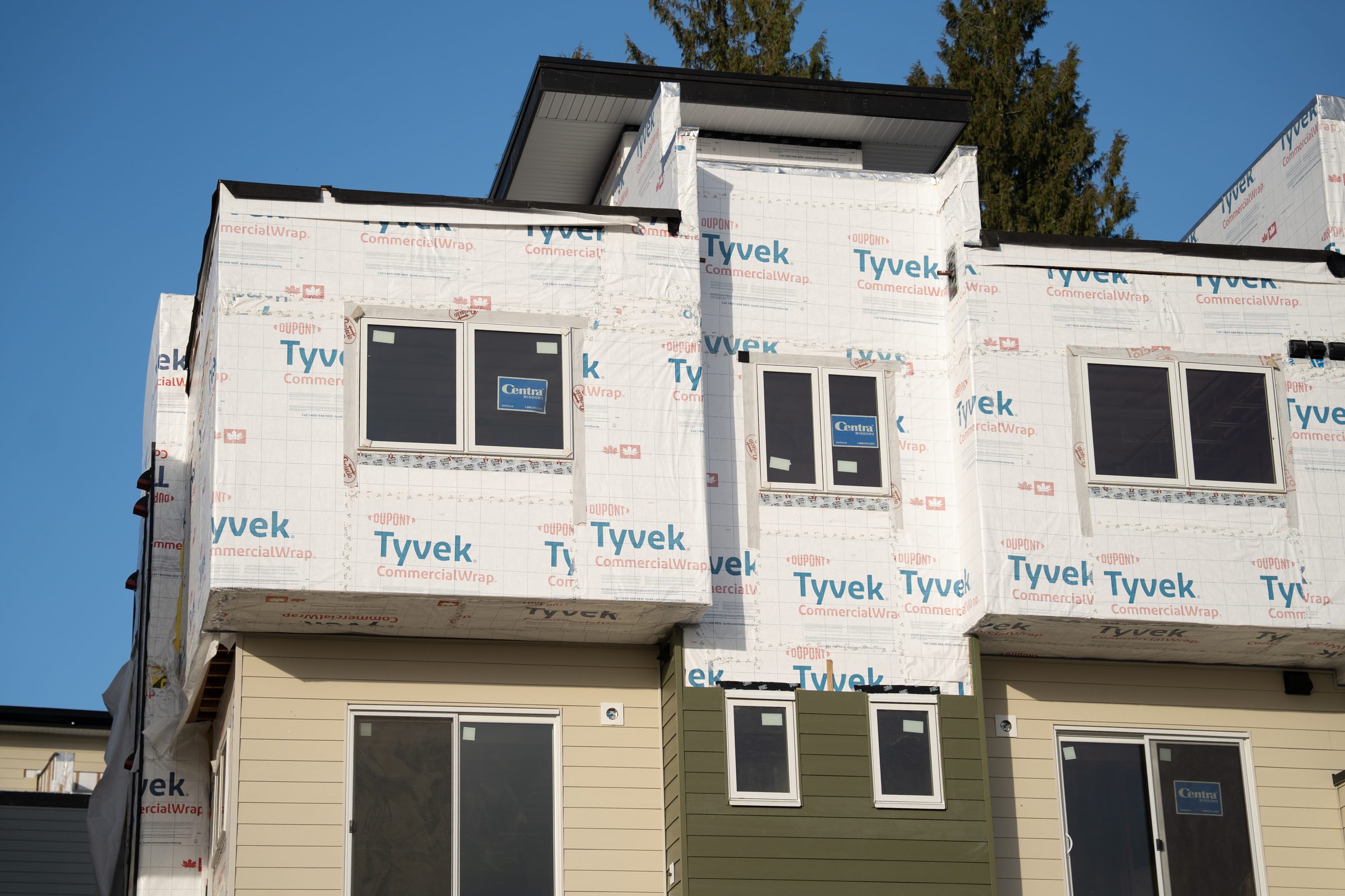 Townhouse framing and building envelope installation on a BC Legacy multi-family site